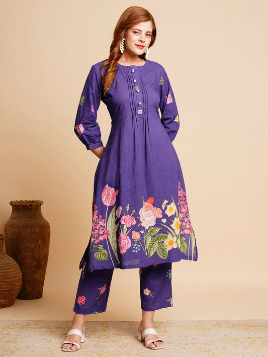 Woman in purple cotton kurta set with floral print and straight pants, ethnic wear fashion
