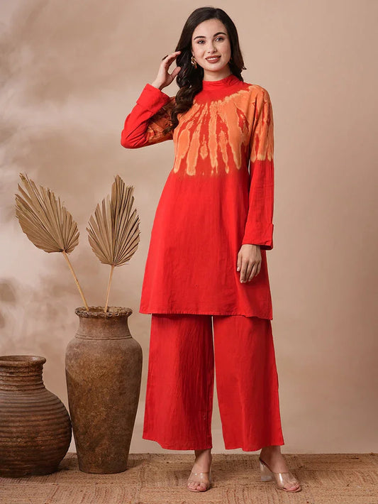 Woman wearing a red and orange tie-dye pure cotton kurta set with wide palazzo pants