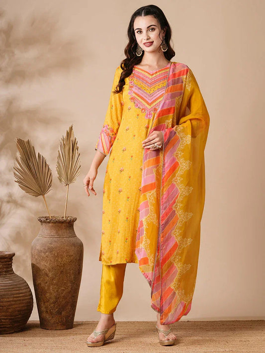 Woman wearing yellow cotton kurta set with printed dupatta, ethnic wear, indoor setting
